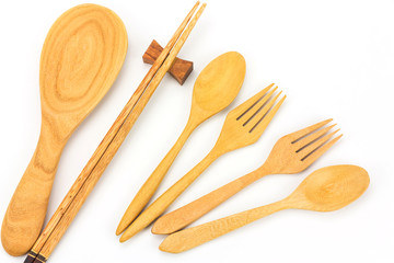 Assorted wooden tableware on white background
