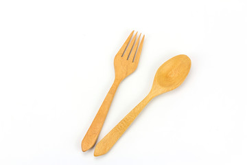 Assorted wooden tableware on white background