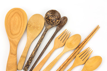 Assorted wooden tableware on white background