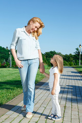 Fototapeta premium Mother and daughter during walk 