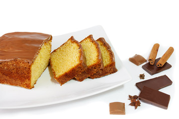 Cake with glaze of chocolate and spices  isolated on white