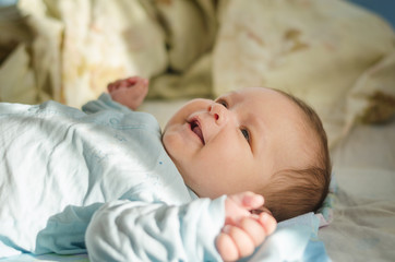 Beautiful newborn baby smiling