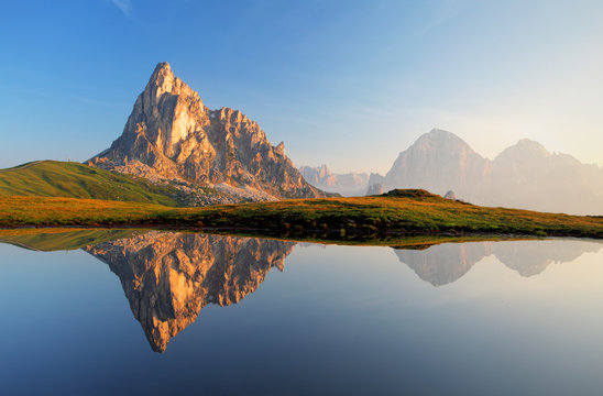 Fototapeta Mountain lake reflection, Dolomites, Passo Giau