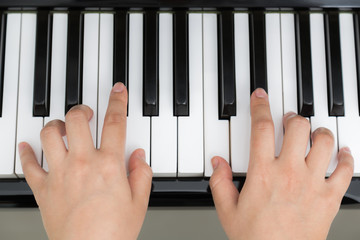 Close up of woman hands  playing piano