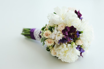 weddingl bouquet of peonies and roses