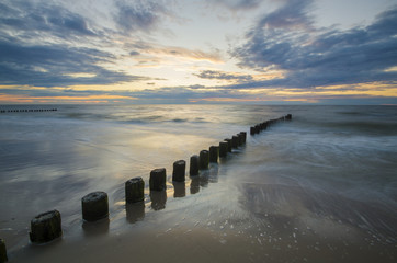 Fototapeta premium sunset over the sea beach