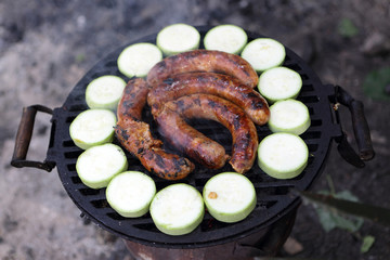 Cooking sausages and squash