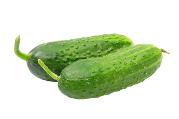 Two ripe green cucumbers taken closeup.Isolated.