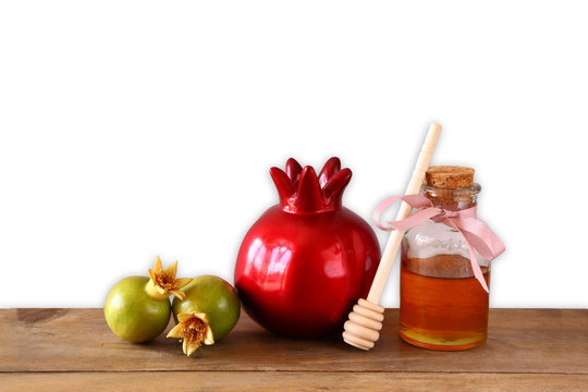 rosh hashanah (jewish holiday) concept - honey and pomegranate