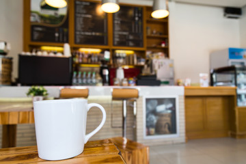 Fototapeta na wymiar Coffee cup on table in cafe