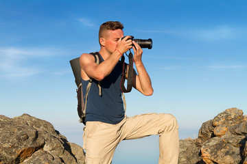man, photographer, in the mountains