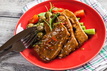 Pork chop with sauce and asparagus