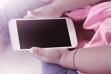 kid's hands hold smart phone,tablet,cellphone for playing