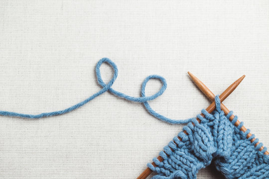 Incomplete knitting project with wooden needles