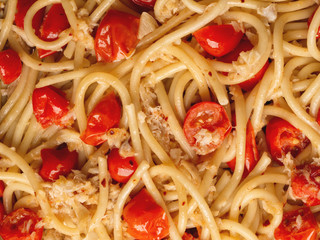 italian crab and cherry tomato spaghetti pasta food background