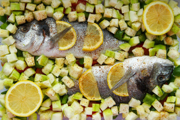 fish dorado with vegetables and lemon