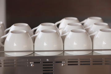 Empty coffee cup on coffee machine