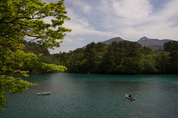 Fototapeta na wymiar Boats at Goshiki-numa lake, Fukushima Prefecture, Japan