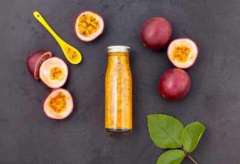 Fresh passion fruit and juice in the bottle for healthy and refr