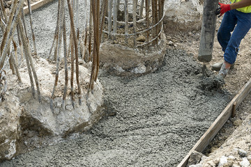 Manual Worker Pouring Concrete       