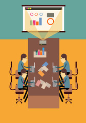 Businesspeople Sitting In A Conference Room Looking At projector