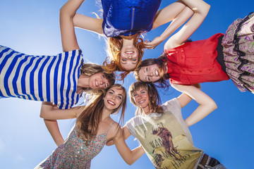 Women girlfriend laugh against the sky