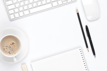 Office desk table with computer, supplies and coffee cup