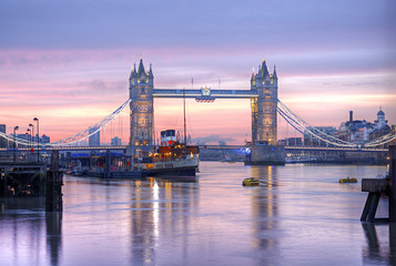 Famous Tower Bridge in front of colorful sky at morning before sunrise, HDR image, London, England, United Kingdom