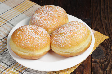 Three sugary donuts