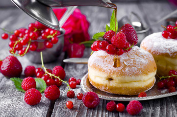 Morning breakfast with mini donuts and berries