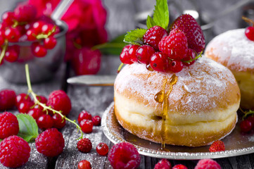 Morning breakfast with mini donuts and berries