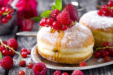 Morning breakfast with mini donuts and berries