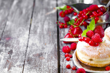 Morning breakfast with mini donuts and berries