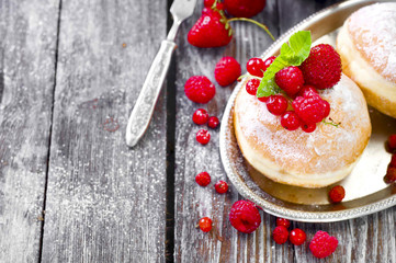 Morning breakfast with mini donuts and berries