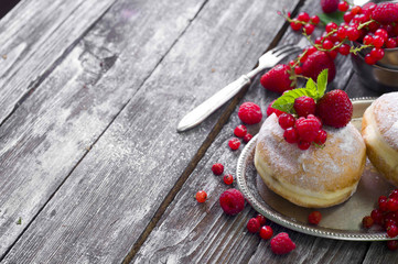 Morning breakfast with mini donuts and berries