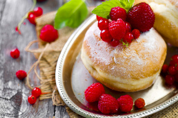 Morning breakfast with mini donuts and berries