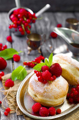 Morning breakfast with mini donuts and berries