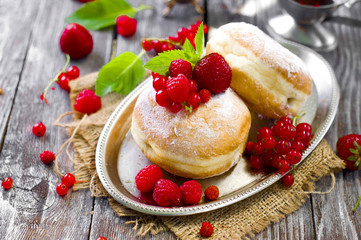 Morning breakfast with mini donuts and berries