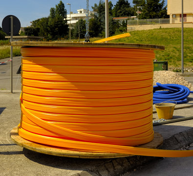 Industrial cable drums of fiber optic cables from underground in a micro trench