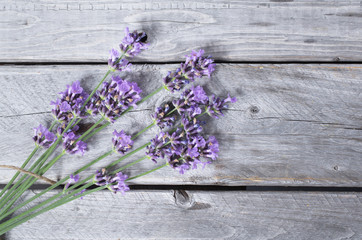 Bouquet of purple lavenders against wooden background