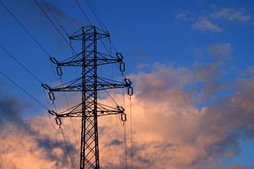 electricity infrastructure in the setting sunlight - obrazy, fototapety, plakaty