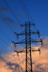 electricity infrastructure in the setting sunlight - obrazy, fototapety, plakaty