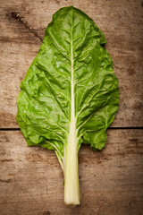 Fototapeta premium Cos lettuce on wooden background