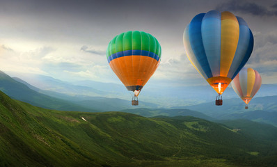 Colorful balloons flying in the mountain
