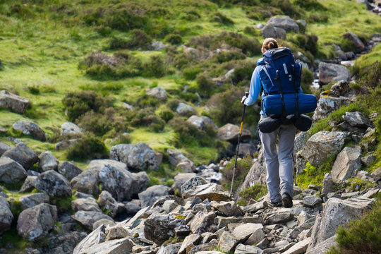 A woman hiker backpacking in the Lake District.