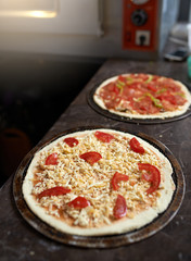 harvesting pizza with cheese on  table