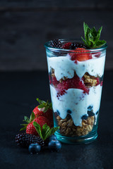 Homemade fresh parfait on black background