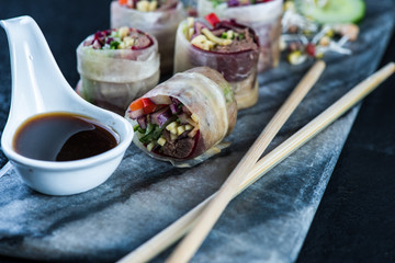Oriental teriyaki beef bites on marble board