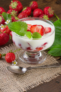 Strawberries Dessert in a glass with vintage spoon