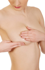 Fototapeta premium Woman examining breast.